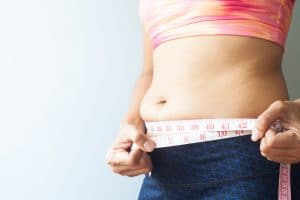 Slimming woman with belly fat sporty woman
